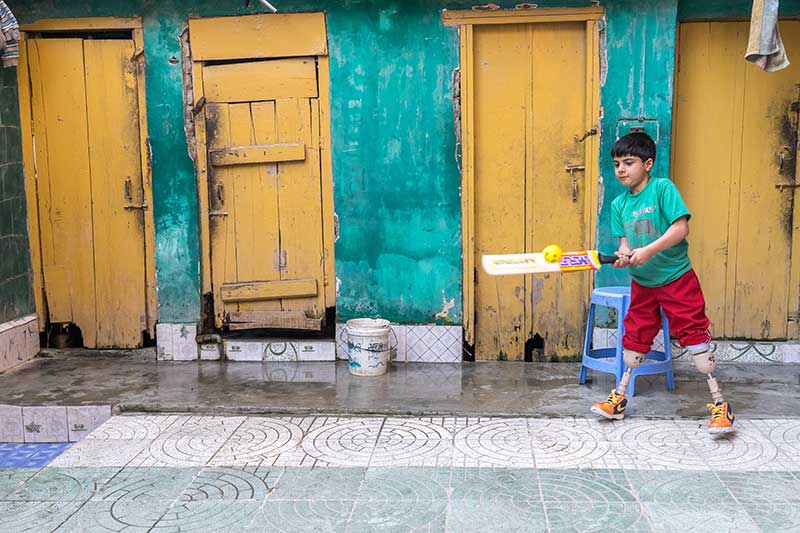 Fayaz plays a shot with his cricket bat