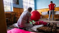 Carers doing rehabilitation exercises with children with multiple disabilities in a refuge in western Ukraine. Carers doing rehabilitation exercises with children with multiple disabilities in a refuge in western Ukraine.