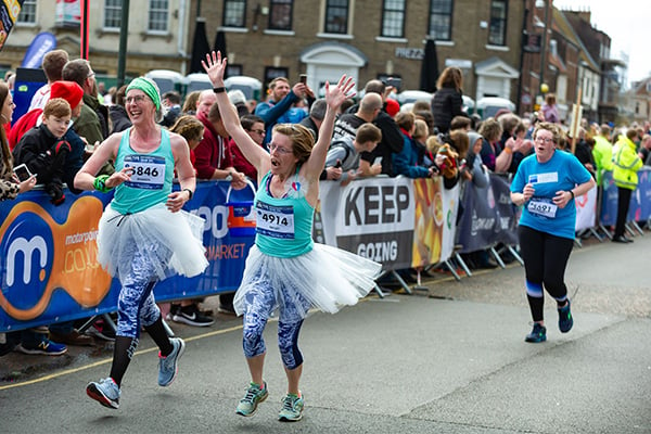 Runners at Gear 5k wearing running clothes and ballerina skirts