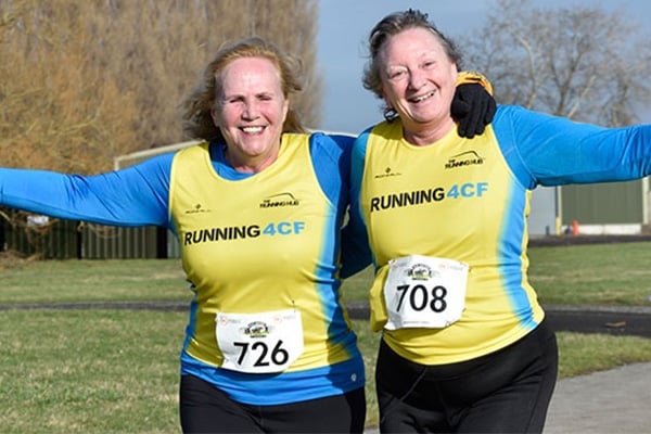 Runners smile at the camera at Nantwich 10k