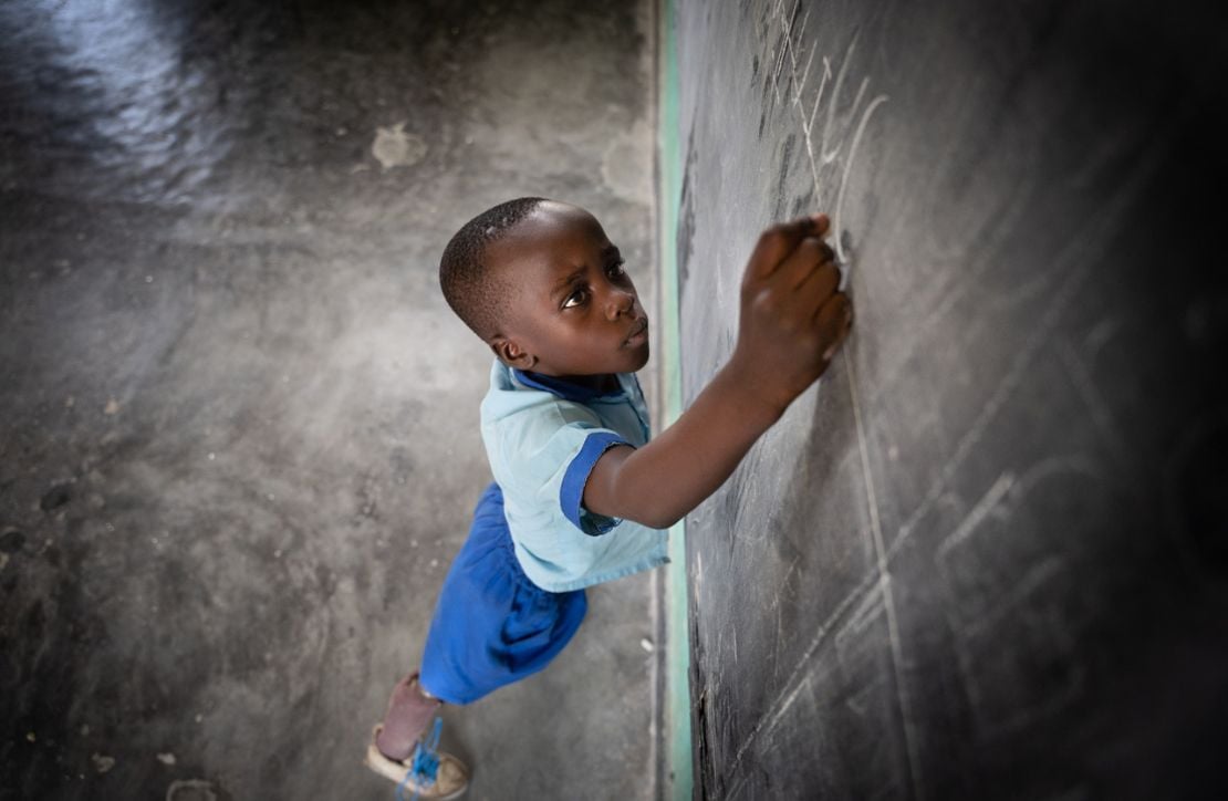 Longini writing on a blackboard