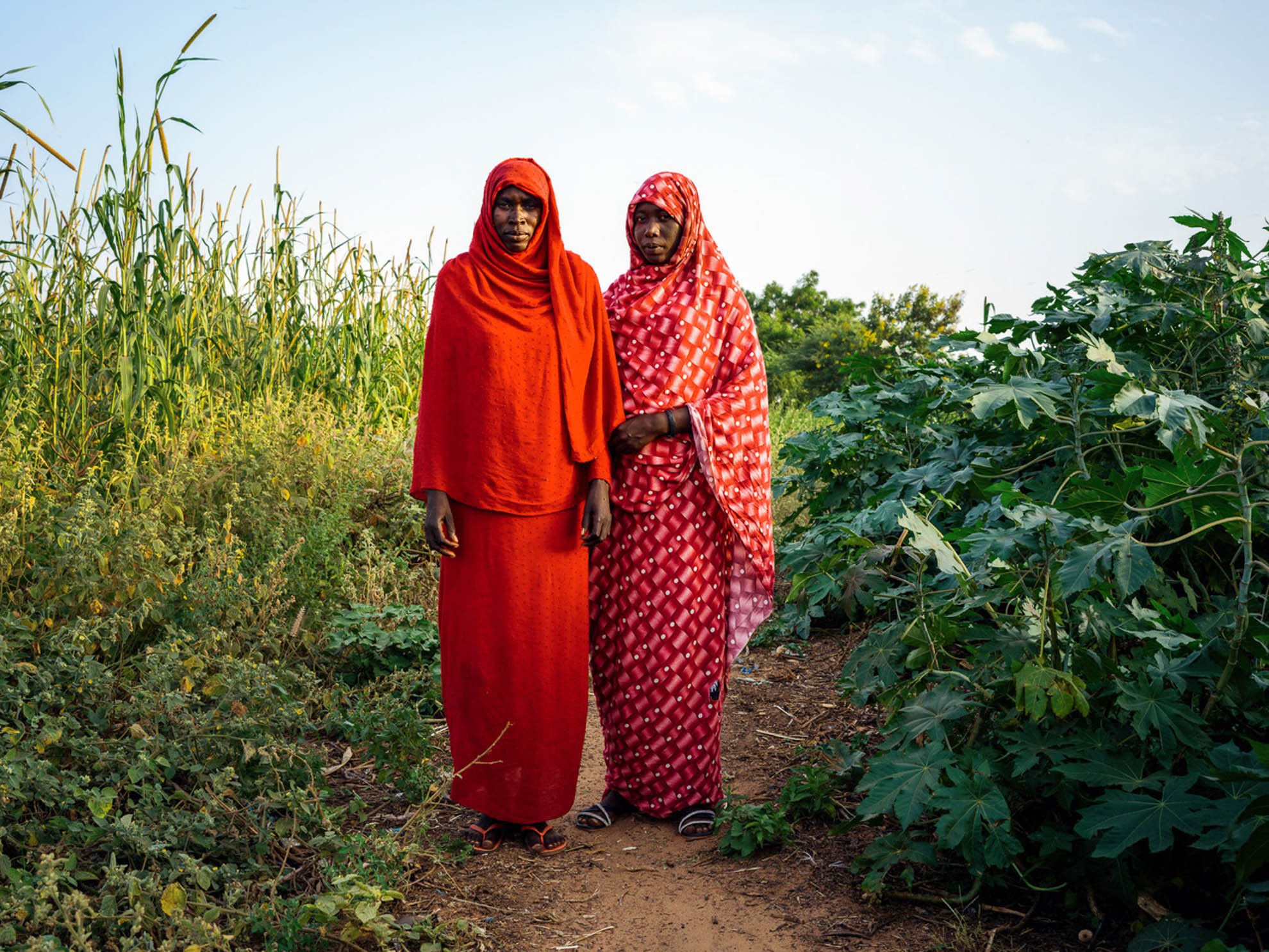  Amina and Firdoz standing at the edge of the bush