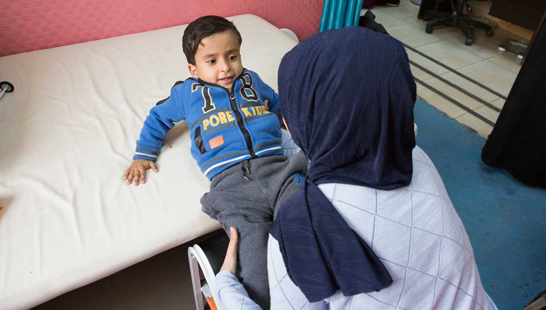 5-year-old Mohammed having a physiotherapy session, CDC Zarqa, Jordan; }}