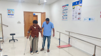 Hussein practicing walking with two prostheses  Hussein practicing walking with two prostheses